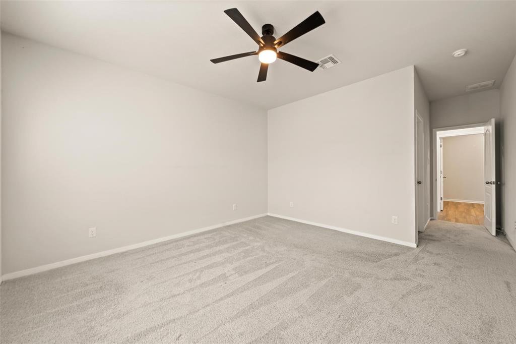 11304 Solar Street Lorena, TX 76655 - Photo 13 of 34 Unfurnished room with light carpet and ceiling fan