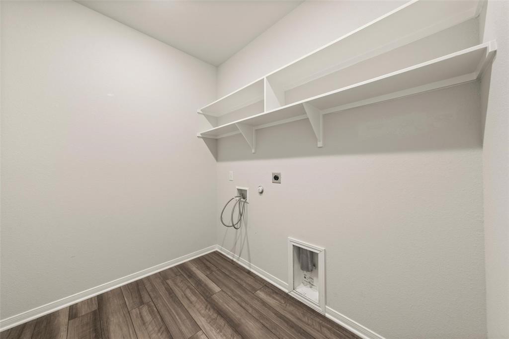 11304 Solar Street Lorena, TX 76655 - Photo 14 of 34 Washroom featuring hookup for a gas dryer, dark wood finished floors, hookup for an electric dryer, and washer hookup