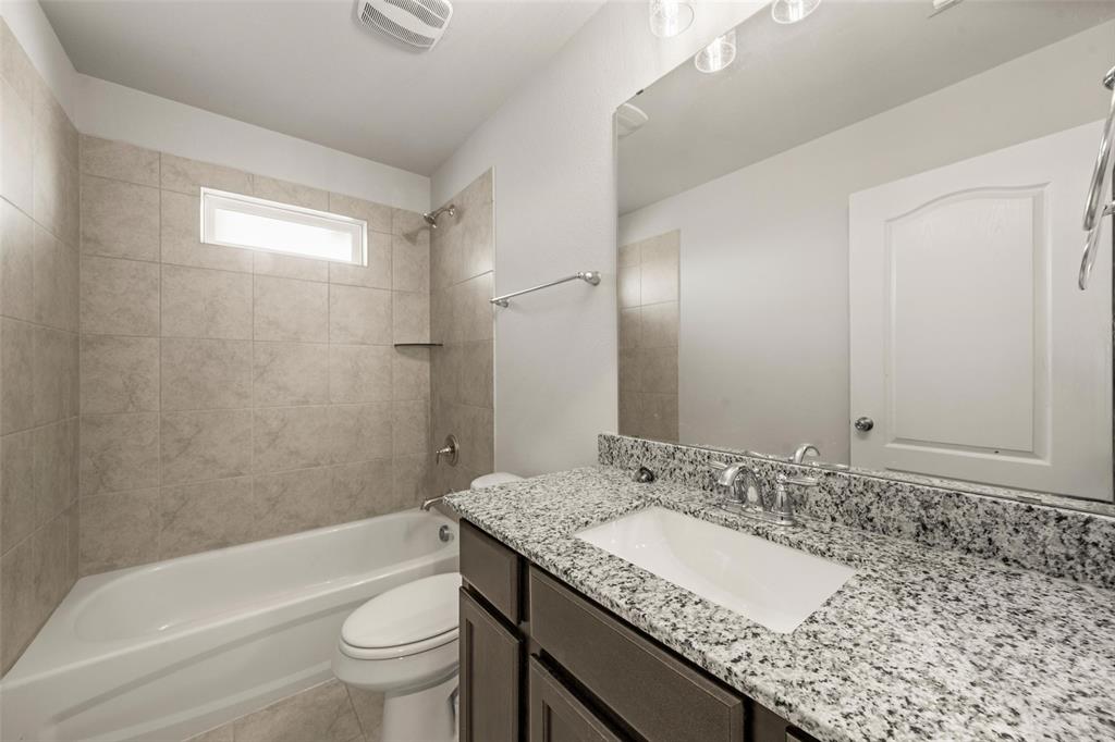 11304 Solar Street Lorena, TX 76655 - Photo 23 of 34 Full bathroom with shower combination, vanity, and light tile patterned floors