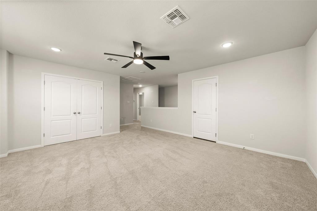 11304 Solar Street Lorena, TX 76655 - Photo 25 of 34 Unfurnished bedroom featuring light colored carpet, attic access, ceiling fan, recessed lighting, and a closet