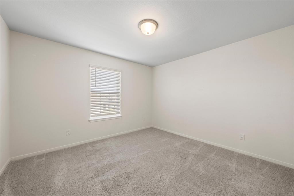 11304 Solar Street Lorena, TX 76655 - Photo 27 of 34 Spare room with light carpet and baseboards