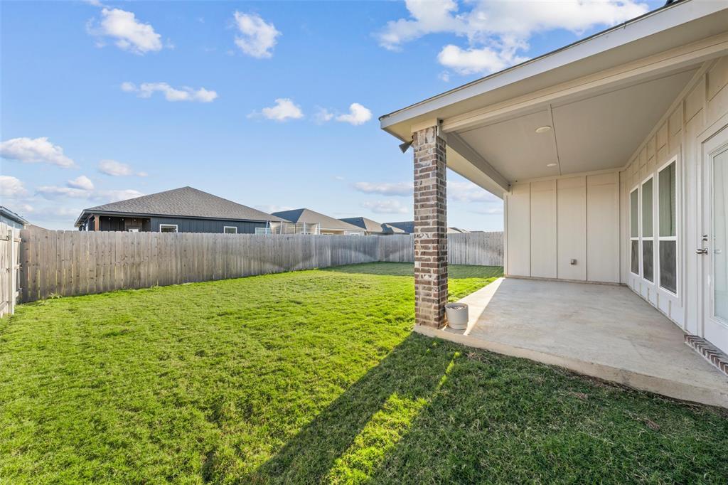 11304 Solar Street Lorena, TX 76655 - Photo 3 of 34 Fenced backyard with a patio