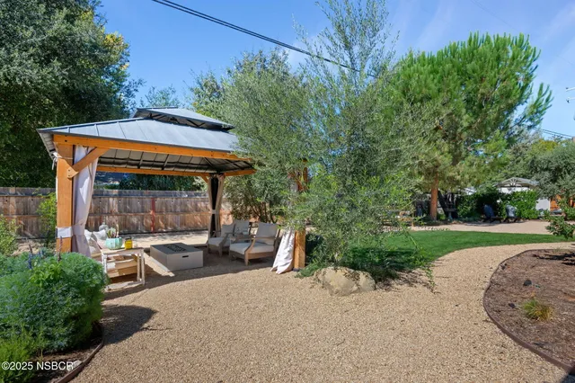 a view of a park with swings and slides