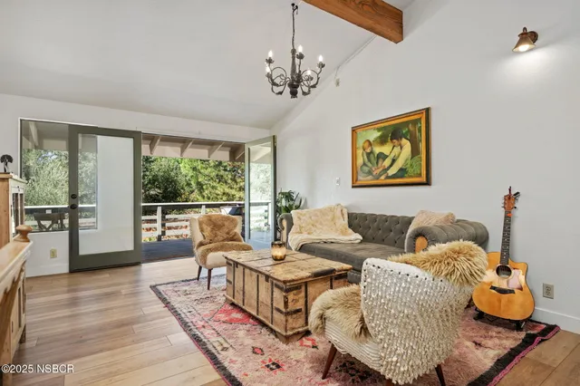 a living room with furniture and windows