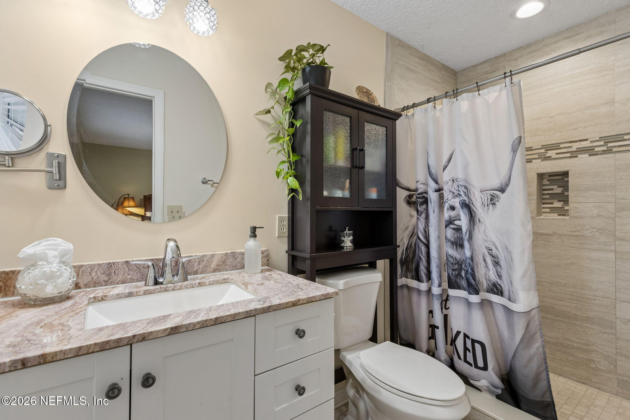 3194 Creighton Landing Road Fleming Island, FL 32003 - Photo 21 of 31 a bathroom with a granite countertop toilet sink and mirror