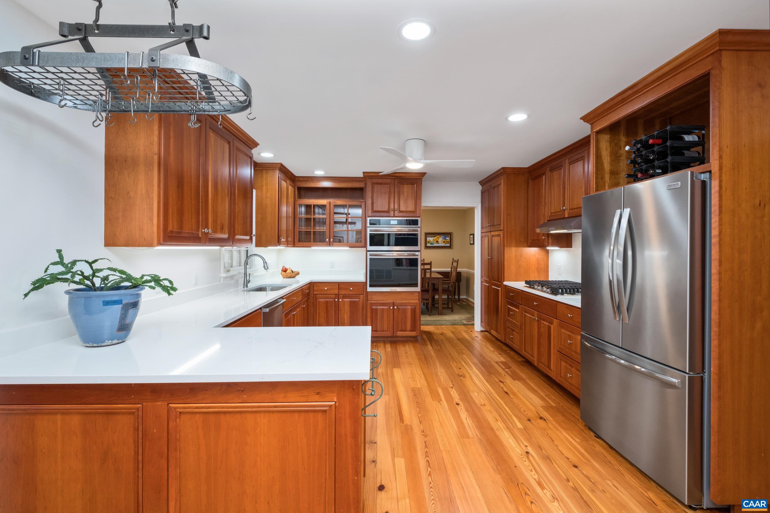 4375 Taylor Creek Road Afton, VA 22920 - Photo 24 of 75 a kitchen with stainless steel appliances a refrigerator a sink a stove and white cabinets