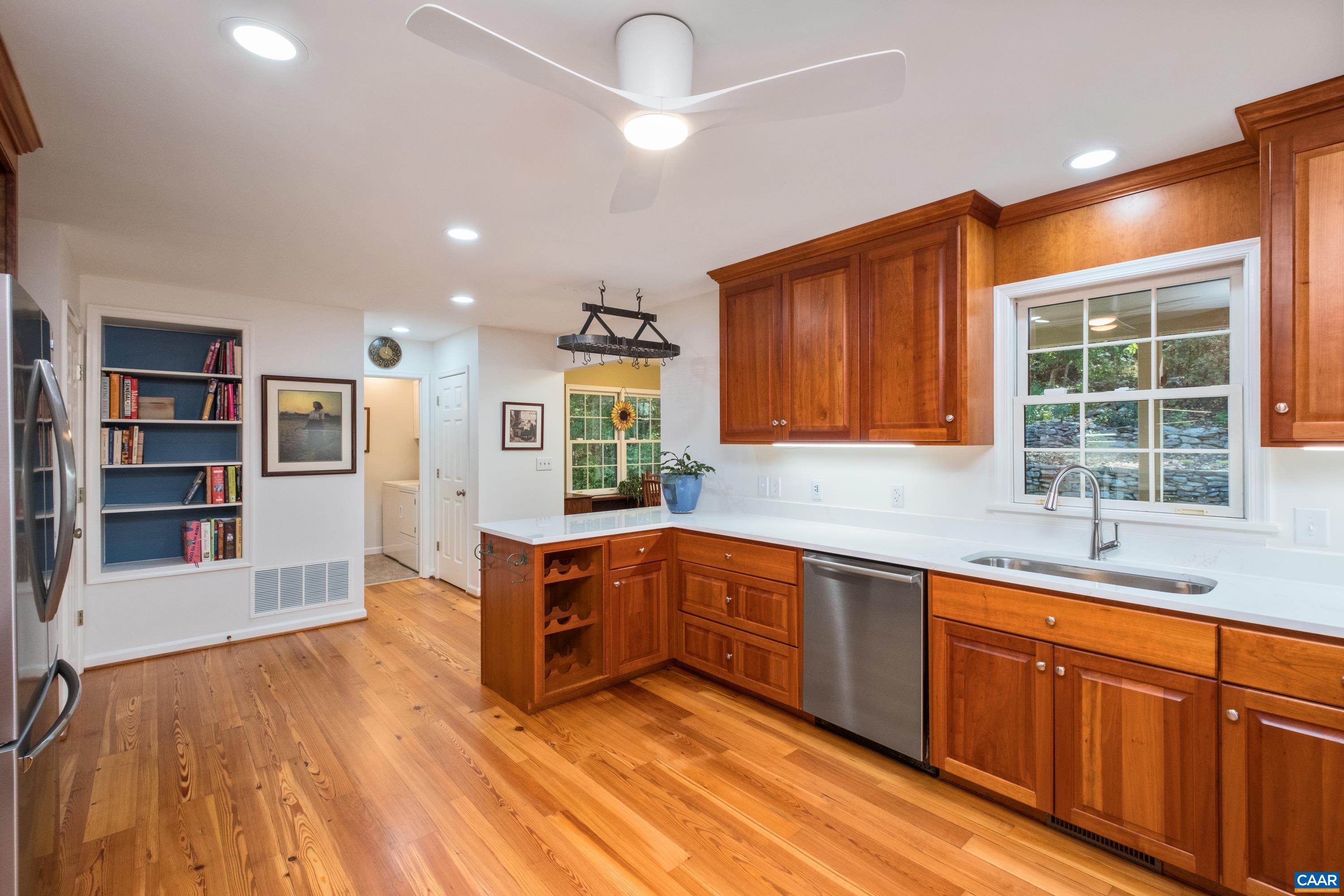 4375 Taylor Creek Road Afton, VA 22920 - Photo 26 of 75 a kitchen with stainless steel appliances granite countertop a sink and dishwasher a stove with wooden floor