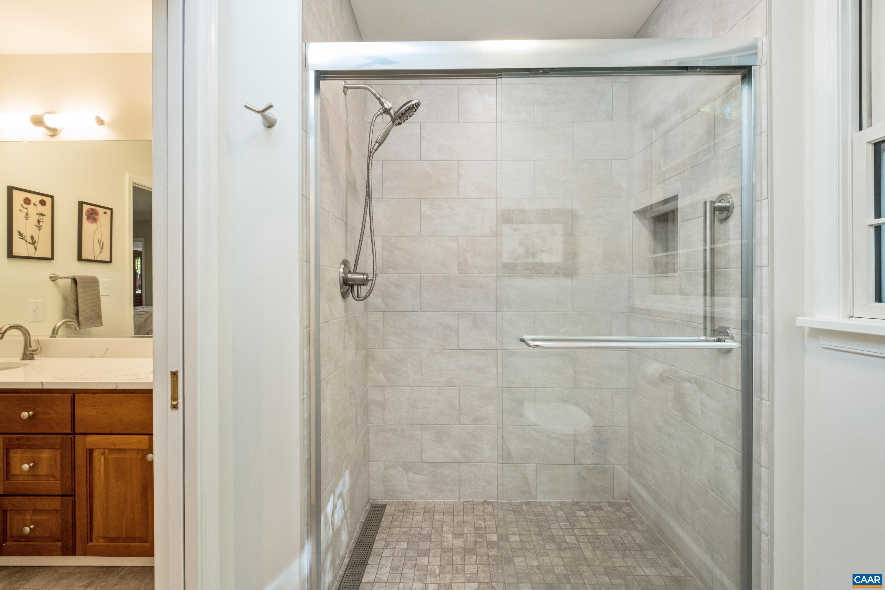 4375 Taylor Creek Road Afton, VA 22920 - Photo 38 of 75 a bathroom with a granite countertop shower mirror and a sink