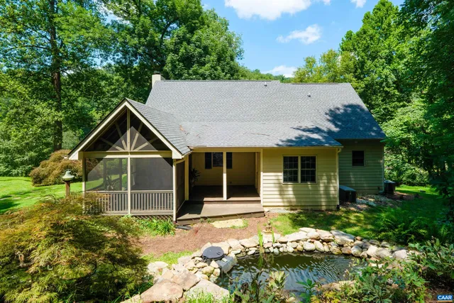 a view of a garden with swimming pool
