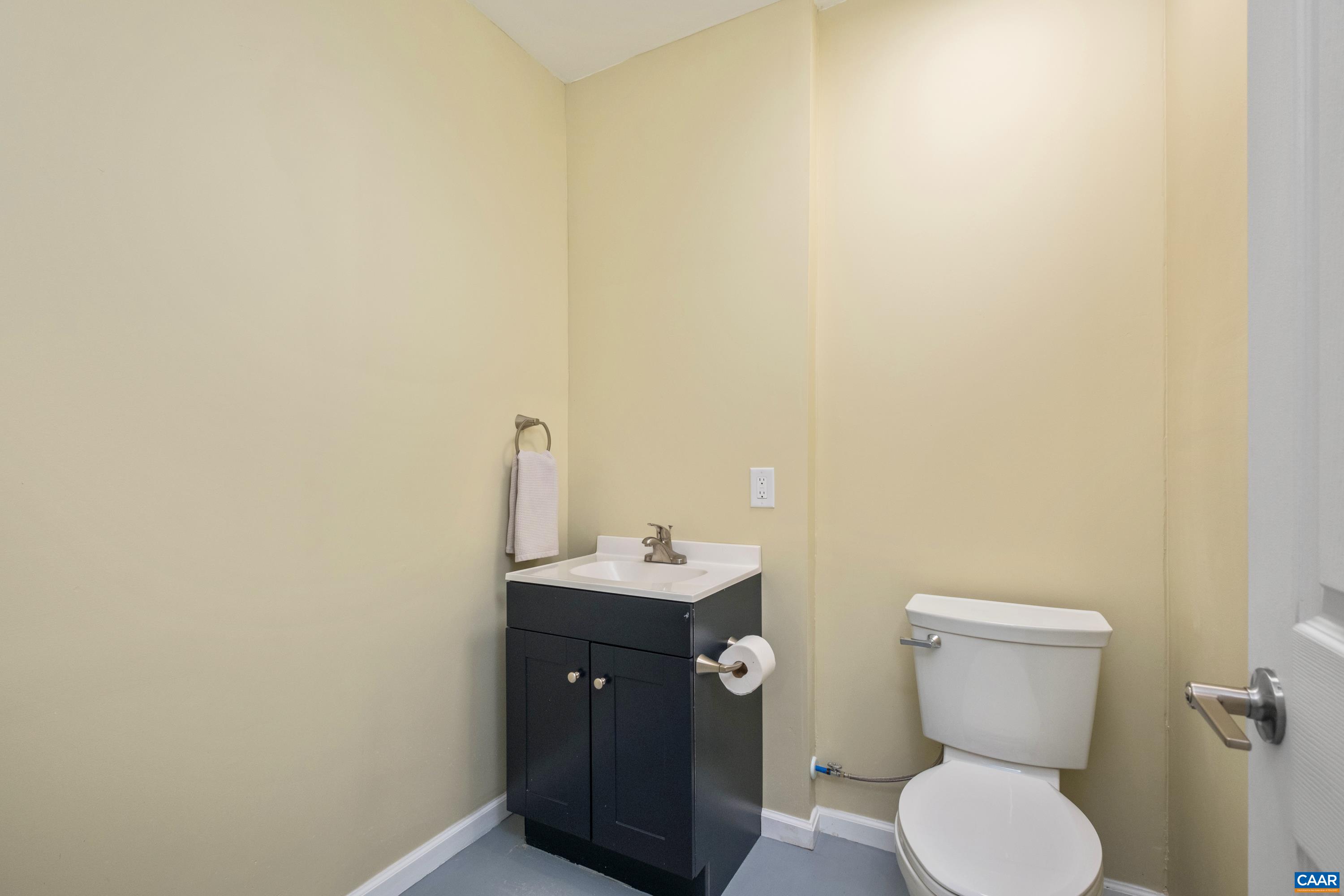4375 Taylor Creek Road Afton, VA 22920 - Photo 62 of 75 a bathroom with a toilet sink and mirror