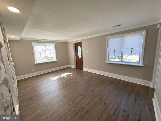 a kitchen with stainless steel appliances a sink a stove and cabinets