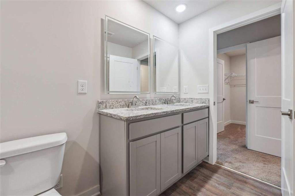 4811 Station Lane Atlanta, GA 30349 - Photo 17 of 25 a bathroom with a sink a toilet and shower