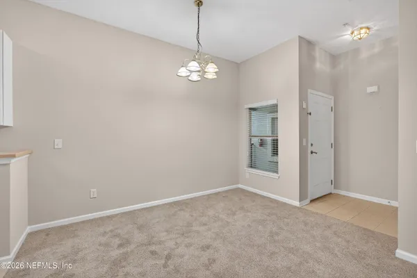 a view of an empty room with a bathroom