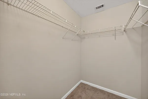 a view of a room with racks on the wall
