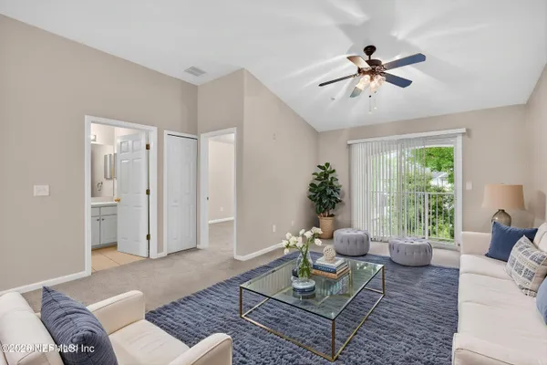 a living room with furniture and a window