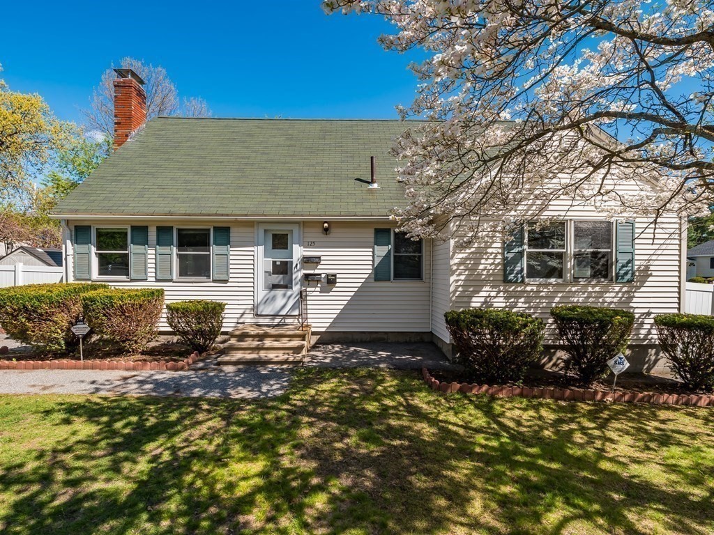125 Columbia Road Lowell, MA 01854 - Photo 31 of 32 a view of a house with a small yard and sitting area
