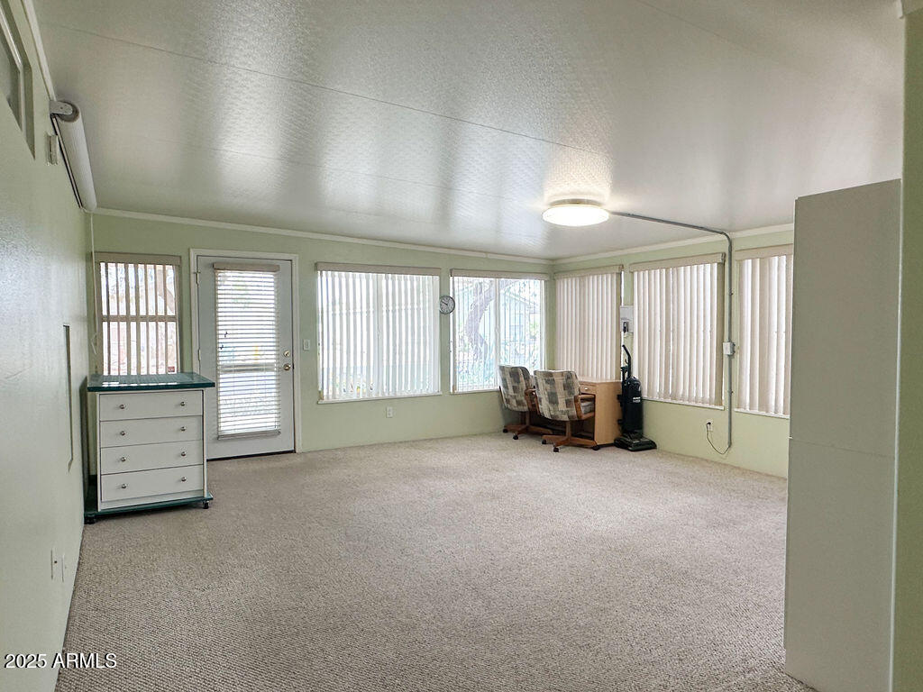 2054 North Thornton Road, Unit 140 Casa Grande, AZ 85122 - Photo 2 of 16 an empty room with furniture and closet