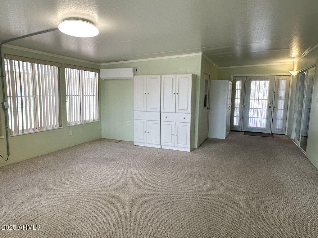 2054 North Thornton Road, Unit 140 Casa Grande, AZ 85122 - Photo 3 of 16 a view of an empty room with a window