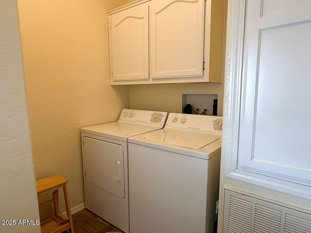 2054 North Thornton Road, Unit 140 Casa Grande, AZ 85122 - Photo 4 of 16 a utility room with dryer and washer