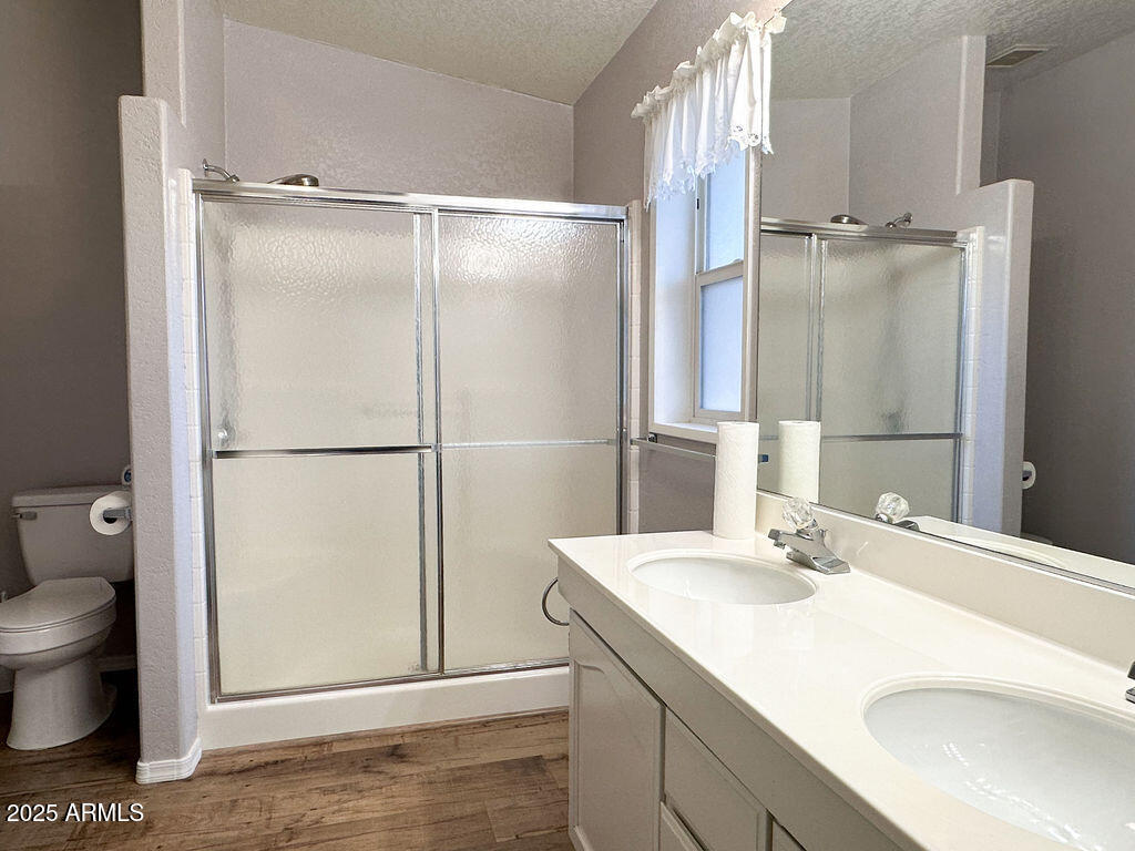 2054 North Thornton Road, Unit 140 Casa Grande, AZ 85122 - Photo 5 of 16 a bathroom with a sink and a mirror