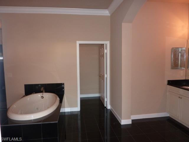 3550 Lansing Loop, Unit 201 Estero, FL 33928 - Photo 6 of 8 a bathroom with a sink and a toilet