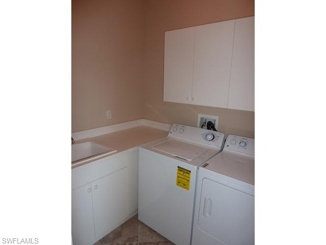 3550 Lansing Loop, Unit 201 Estero, FL 33928 - Photo 8 of 8 a utility room with dryer and washer