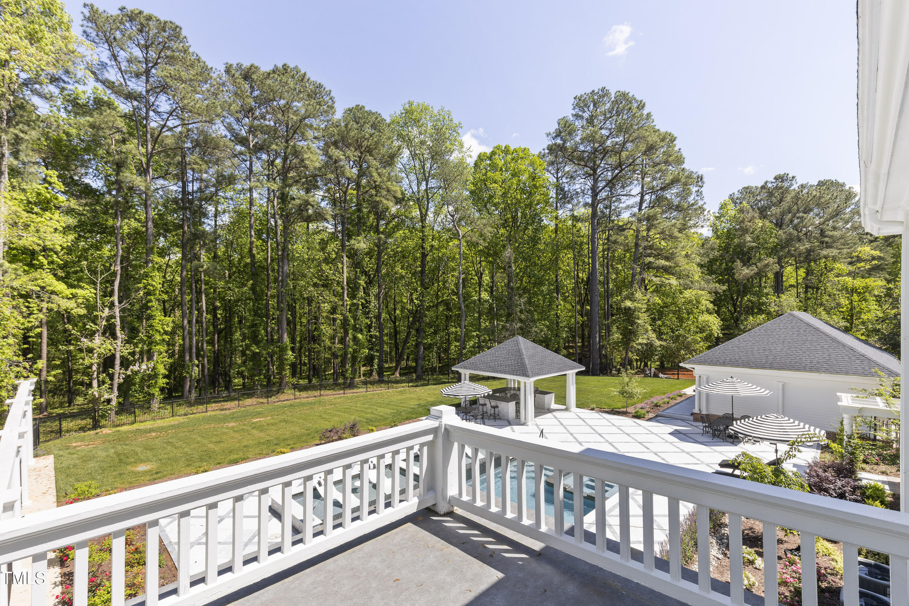 6321 Johnson Pond Road Fuquay-Varina, NC 27526 - Photo 16 of 50 a view of a house with wooden deck and trees