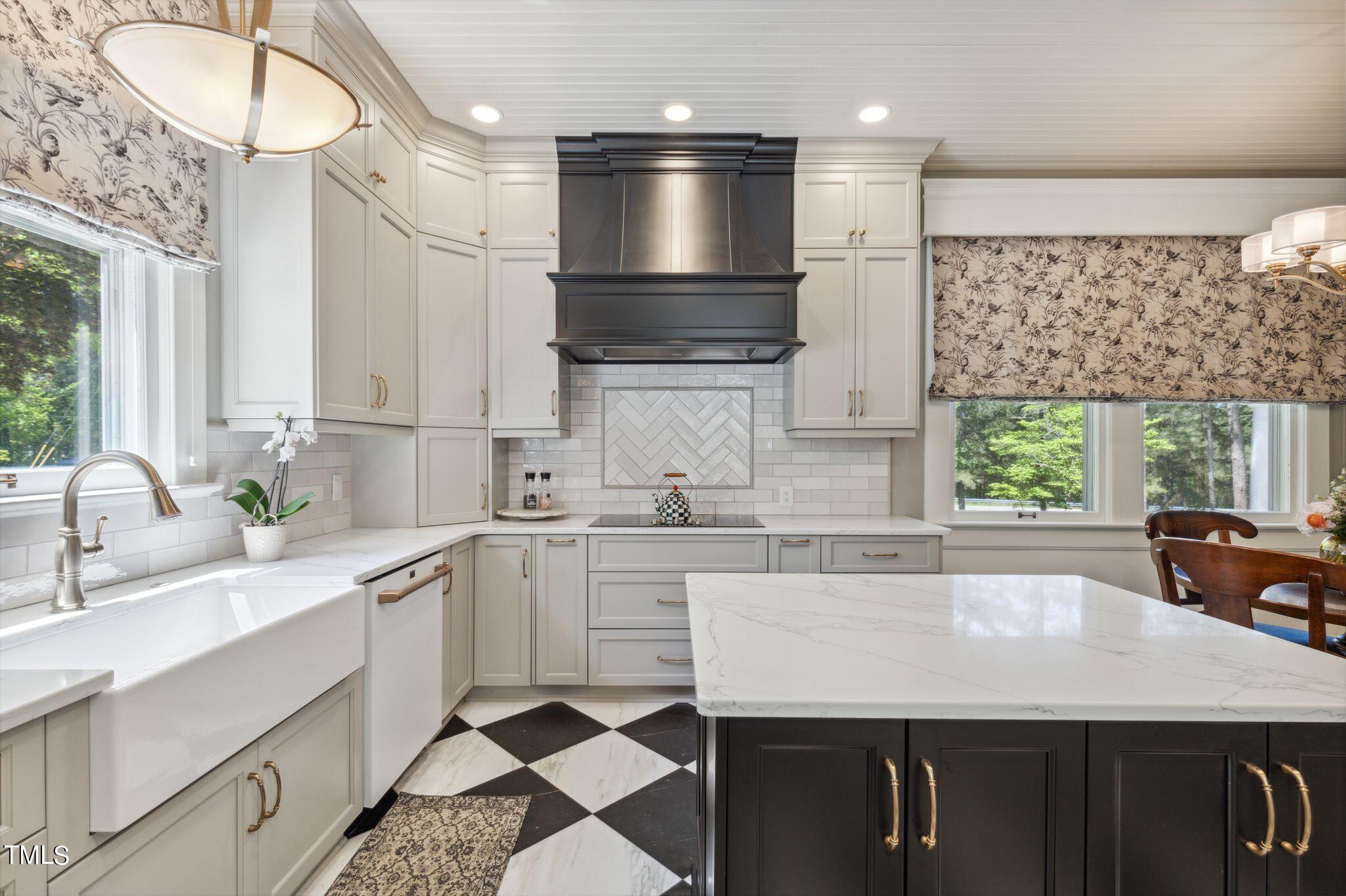 6321 Johnson Pond Road Fuquay-Varina, NC 27526 - Photo 23 of 50 a kitchen with stainless steel appliances a sink a stove and a refrigerator