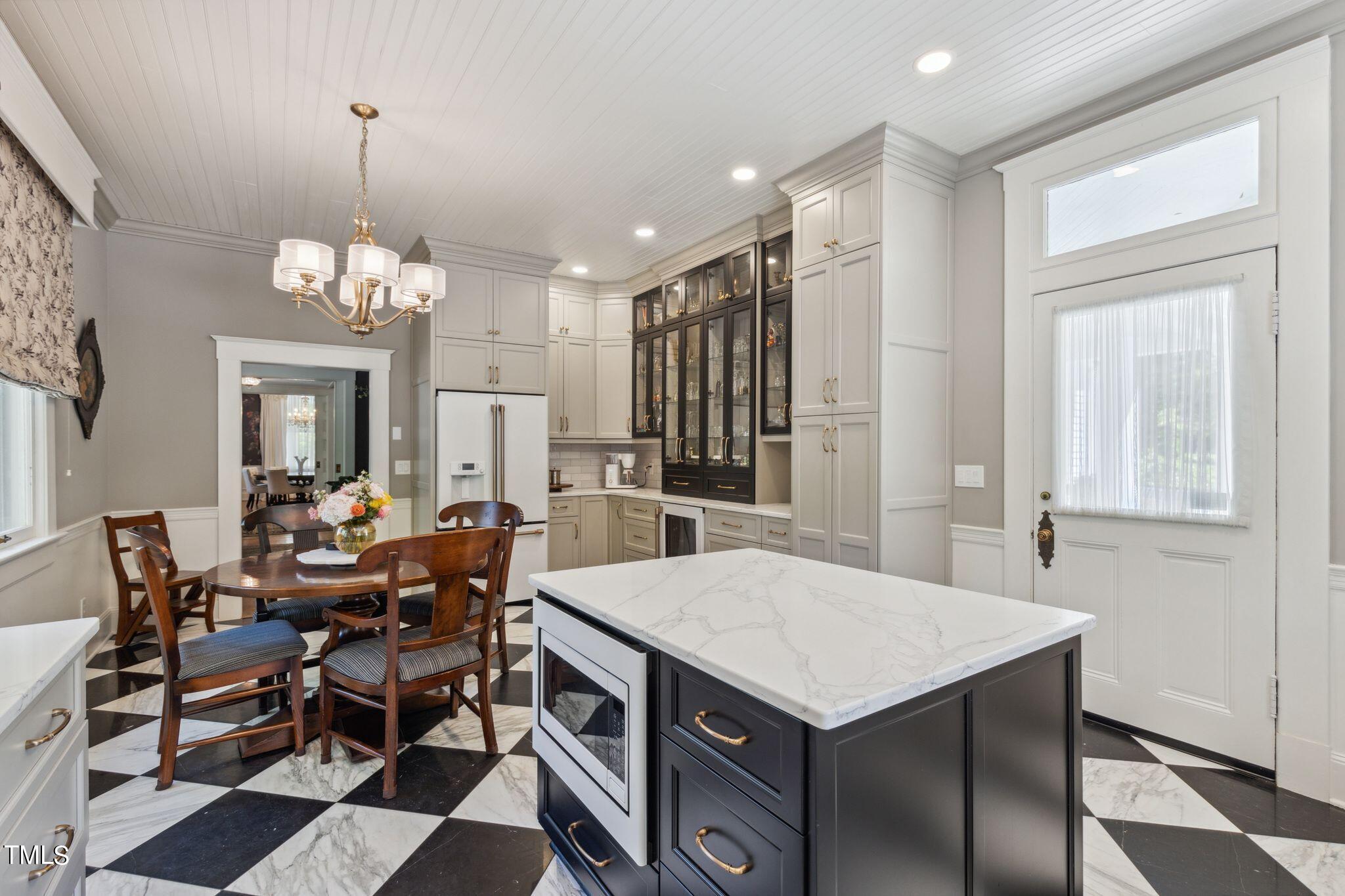 6321 Johnson Pond Road Fuquay-Varina, NC 27526 - Photo 24 of 50 a view of a dining room with furniture and window