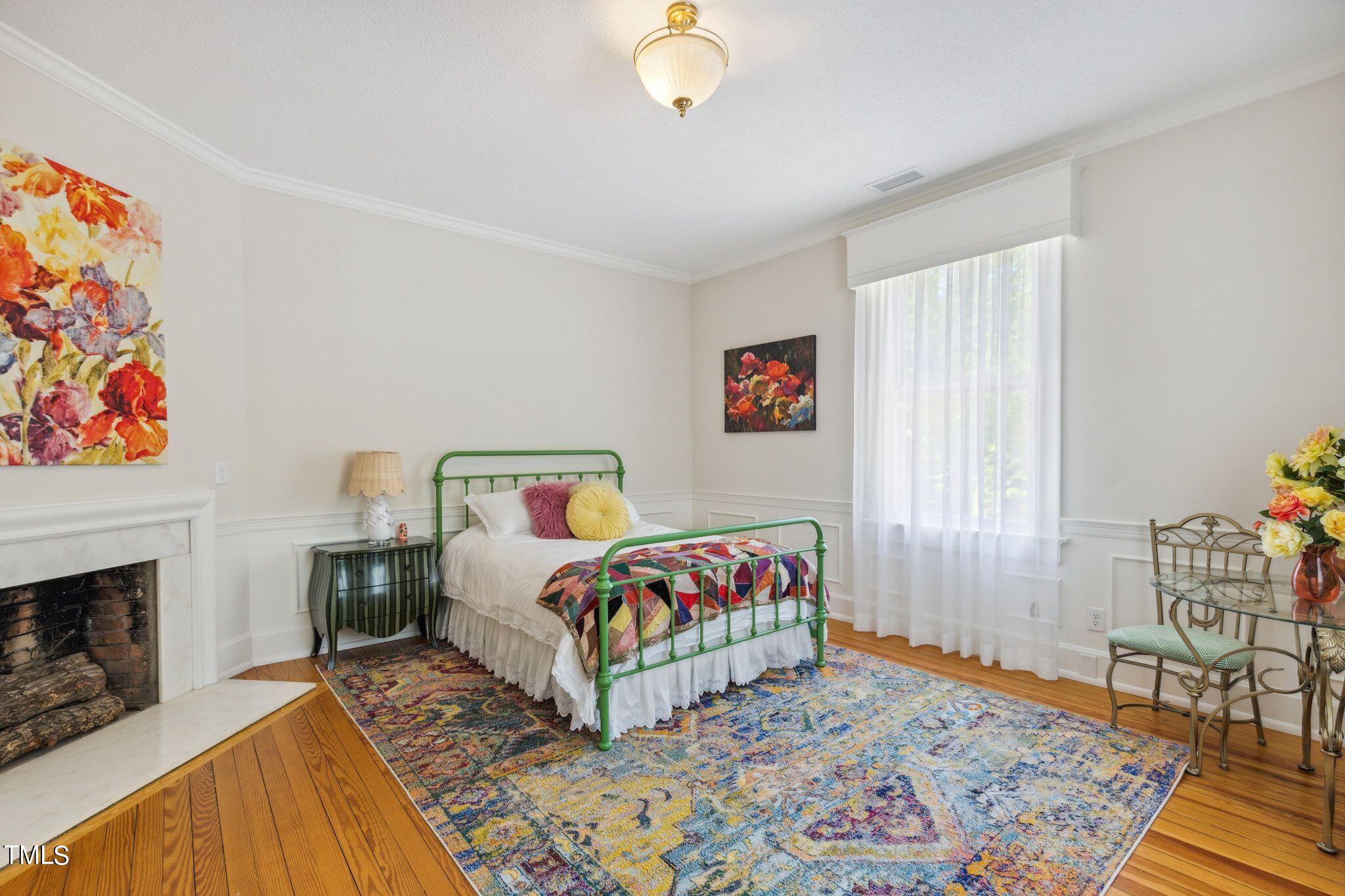 6321 Johnson Pond Road Fuquay-Varina, NC 27526 - Photo 33 of 50 a bedroom with furniture and a fireplace