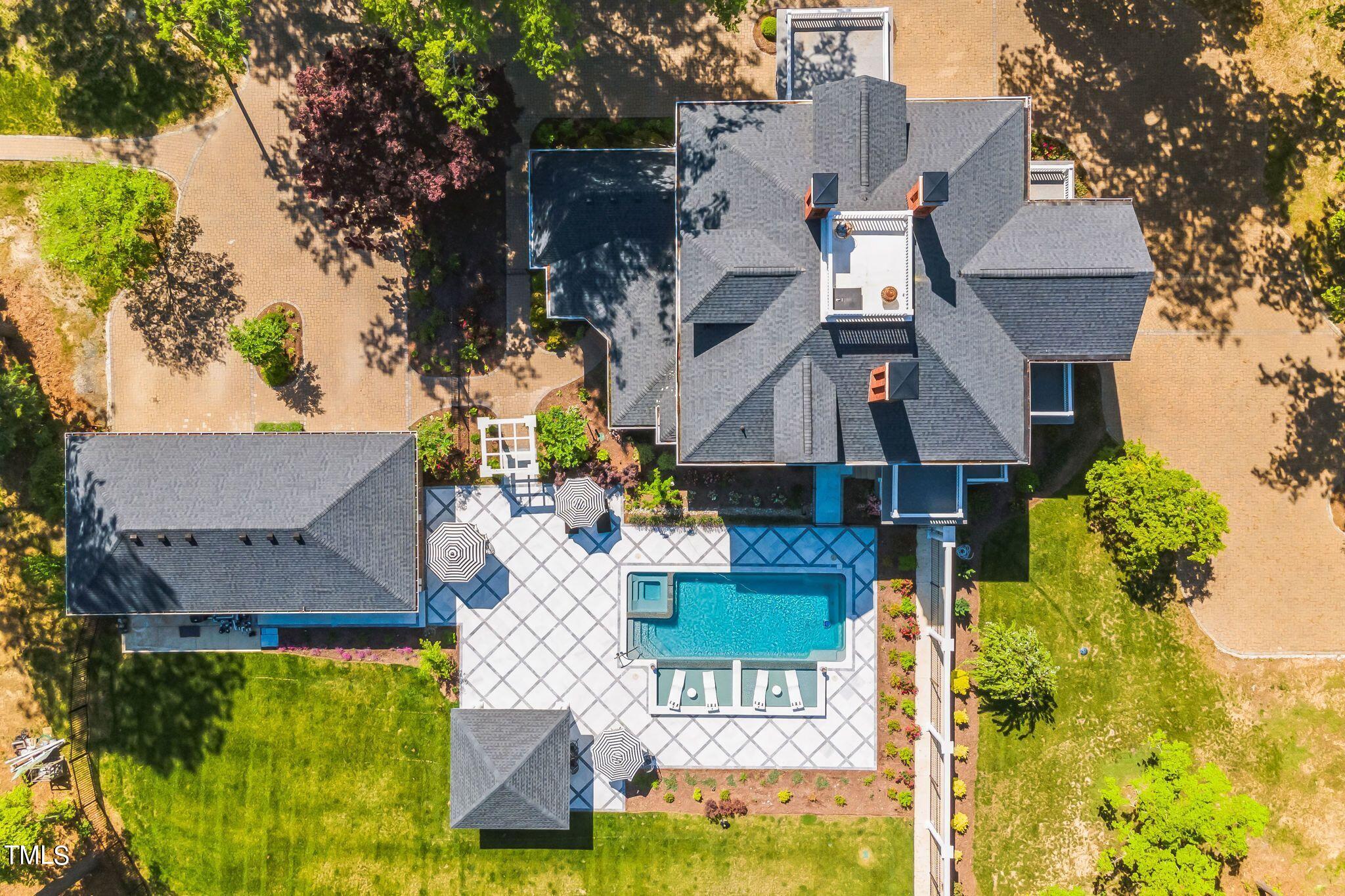 6321 Johnson Pond Road Fuquay-Varina, NC 27526 - Photo 38 of 50 an aerial view of a house with swimming pool and garden