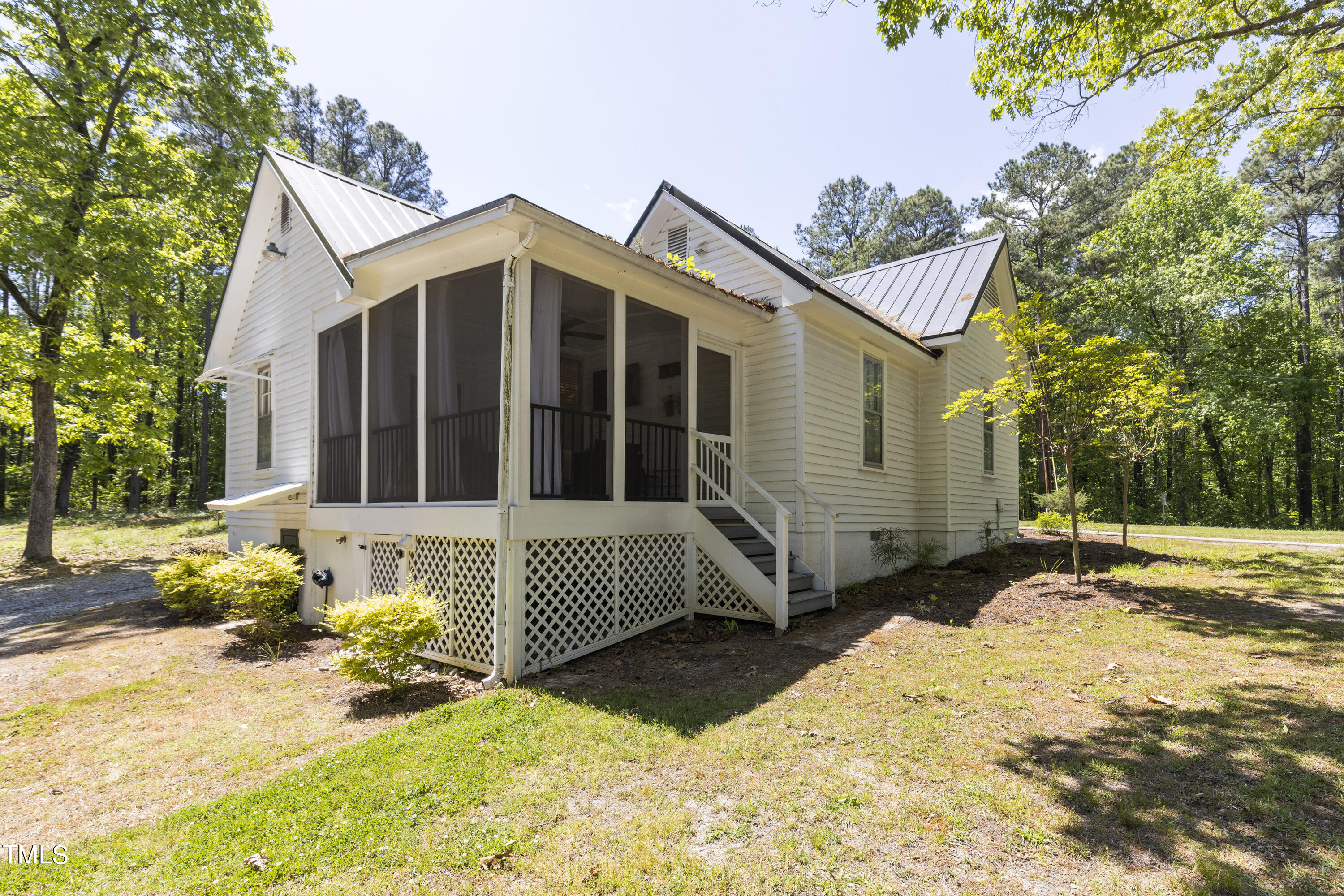 6321 Johnson Pond Road Fuquay-Varina, NC 27526 - Photo 41 of 50 a view of a house with a yard