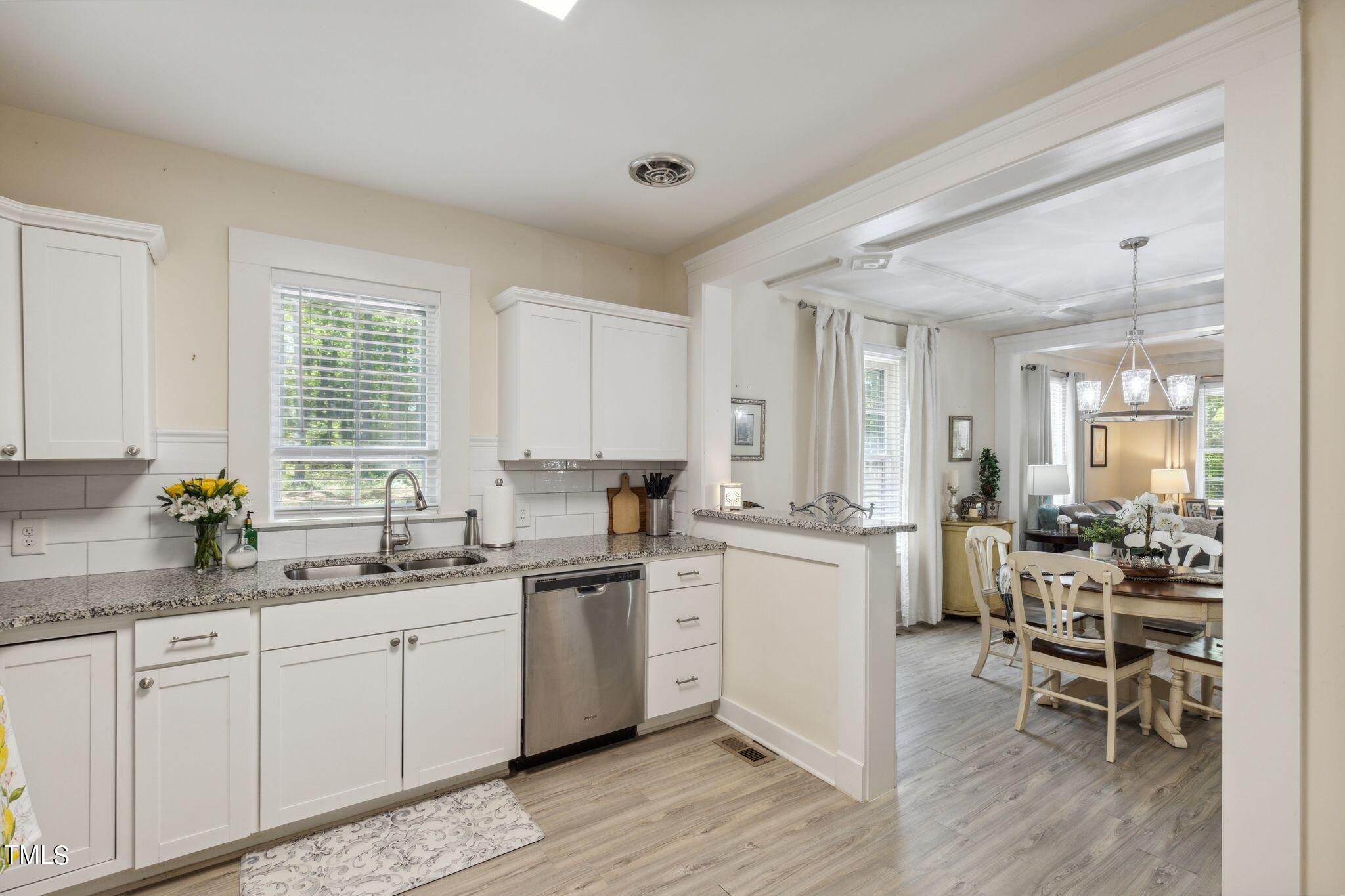 6321 Johnson Pond Road Fuquay-Varina, NC 27526 - Photo 44 of 50 a kitchen with a sink stove and cabinets