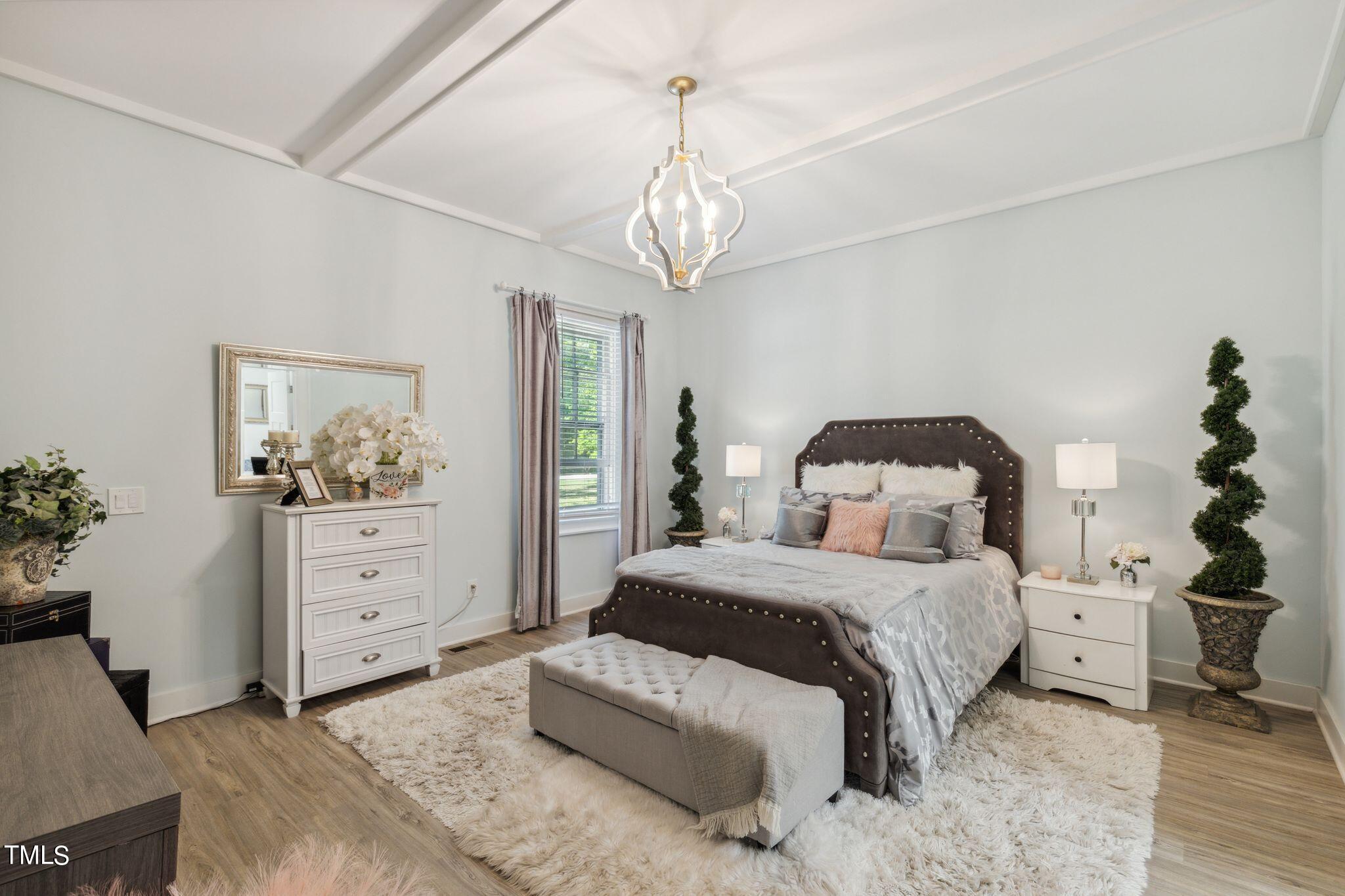 6321 Johnson Pond Road Fuquay-Varina, NC 27526 - Photo 45 of 50 a bedroom with a bed and a dresser