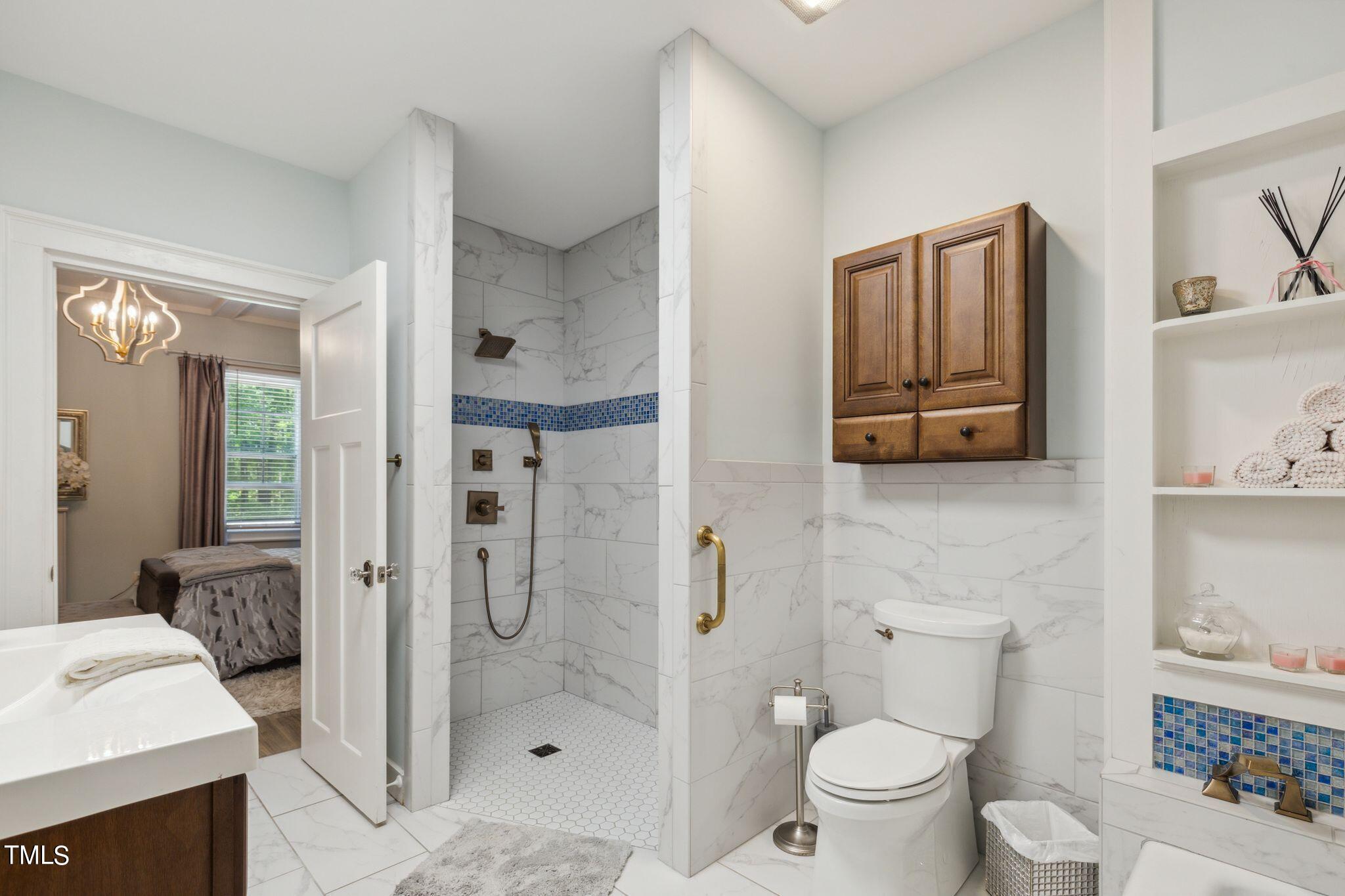 6321 Johnson Pond Road Fuquay-Varina, NC 27526 - Photo 47 of 50 a bathroom with a toilet sink and shower