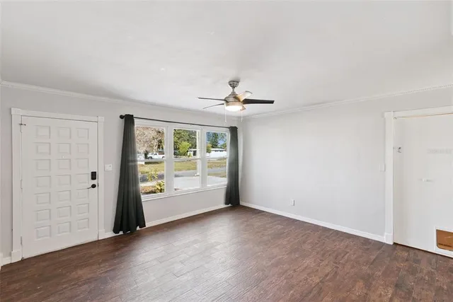 a view of an empty room with a window