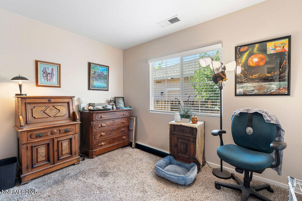 7685 Bichon Street Reno, NV 89506 - Photo 14 of 29 a living room with furniture and a gate