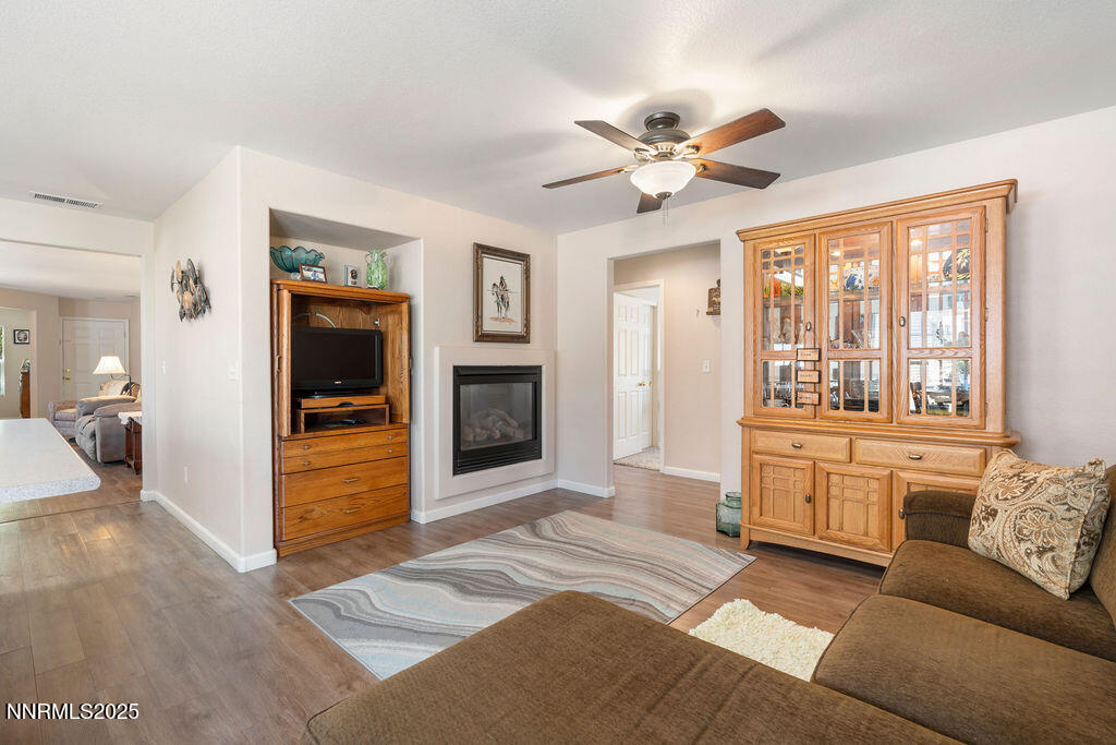7685 Bichon Street Reno, NV 89506 - Photo 6 of 29 a living room with furniture and a fireplace