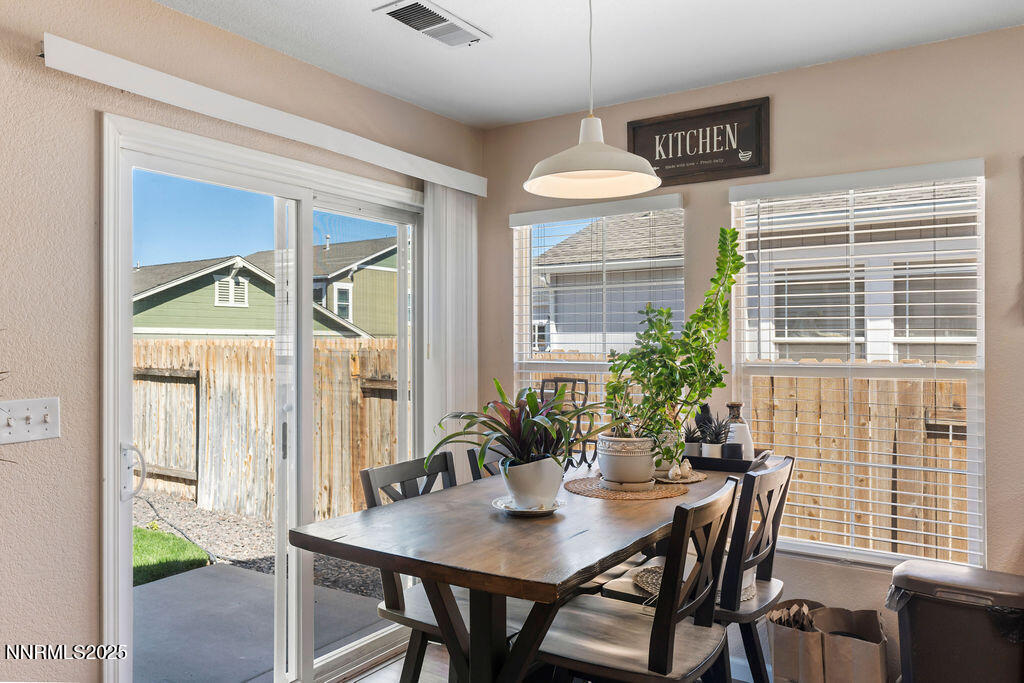 7685 Bichon Street Reno, NV 89506 - Photo 7 of 29 a view of a dining room with furniture window and outside view