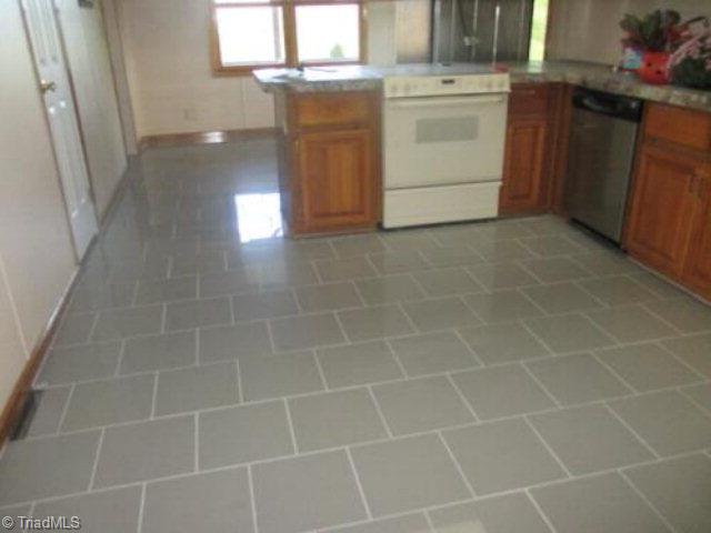 2102 Boomer Road Boomer, NC 28606 - Photo 12 of 16 New kitchen tile