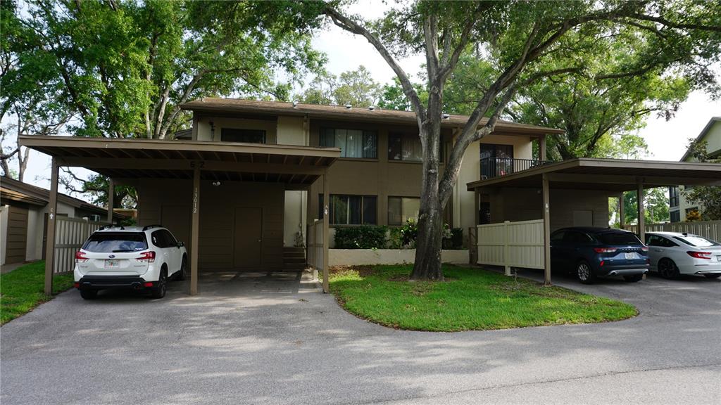 13012 Wedgewood Way, Unit A Hudson, FL 34667 - Photo 1 of 29 a view of a car park in front of house