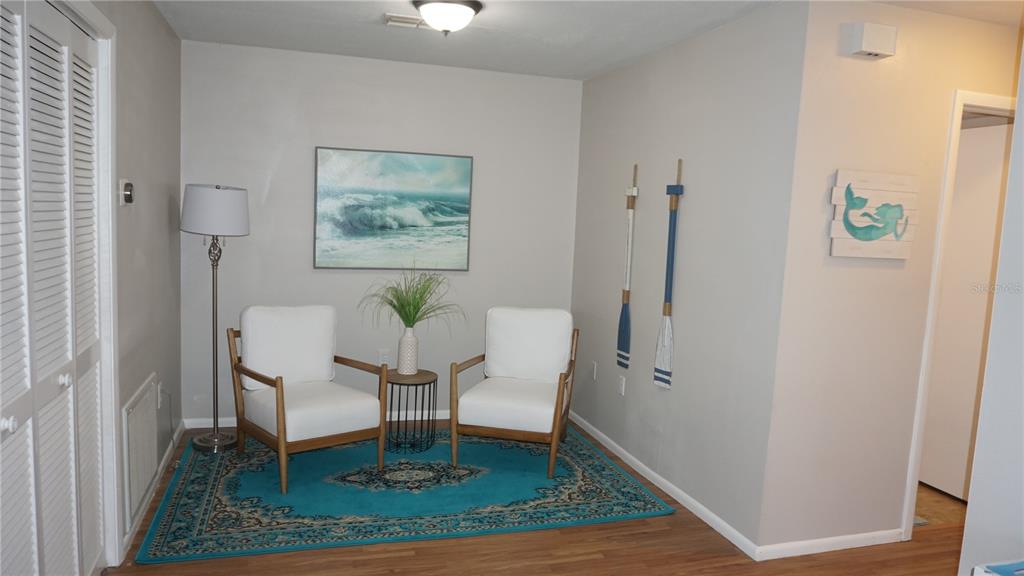 13012 Wedgewood Way, Unit A Hudson, FL 34667 - Photo 11 of 29 a view of a hallway with seating area
