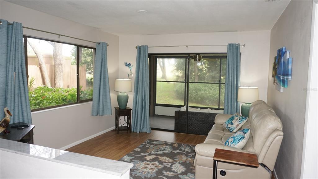 13012 Wedgewood Way, Unit A Hudson, FL 34667 - Photo 12 of 29 a living room with furniture and a window