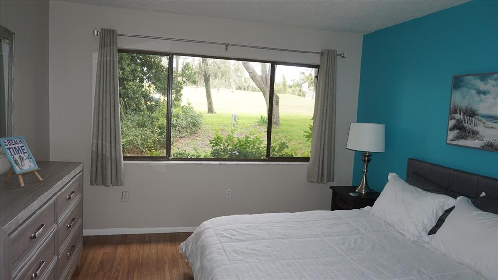 13012 Wedgewood Way, Unit A Hudson, FL 34667 - Photo 16 of 29 a bedroom with a bed and a window