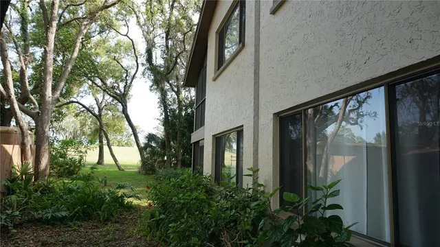 a view of balcony with plants and trees
