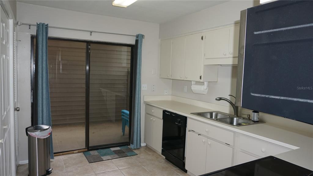 13012 Wedgewood Way, Unit A Hudson, FL 34667 - Photo 5 of 29 a kitchen with a sink and a mirror