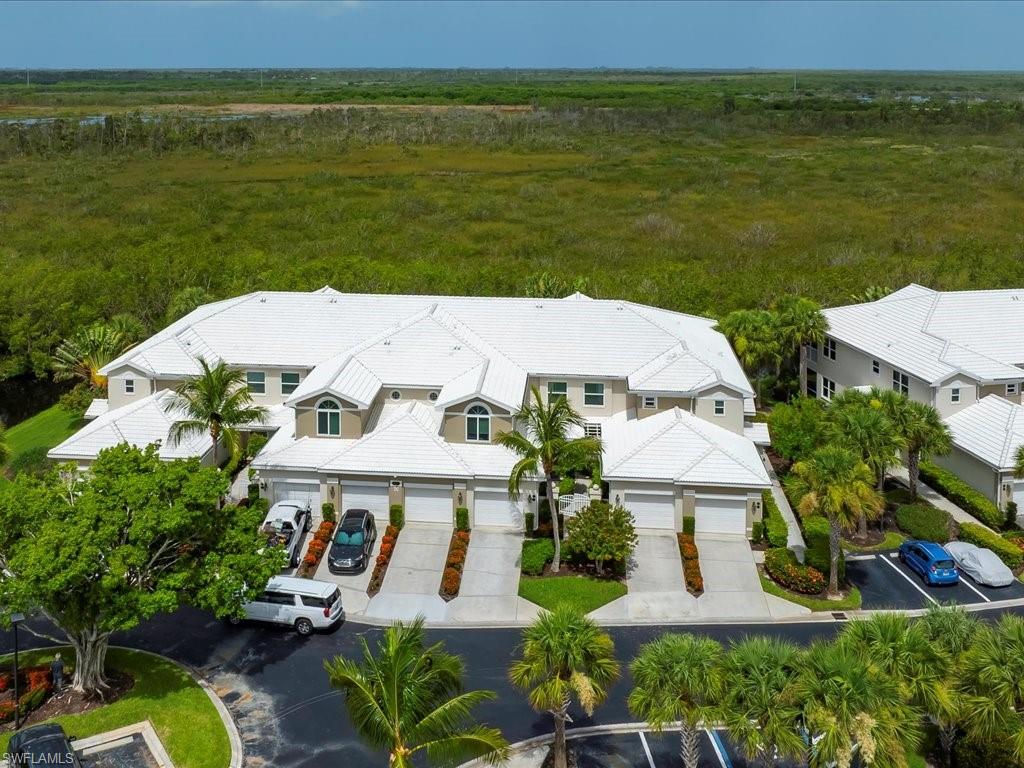 an aerial view of a house with a ocean view