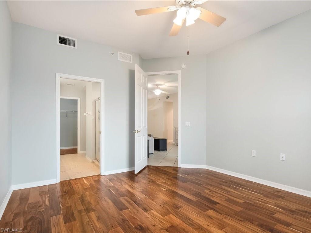4655 Hawks Nest Way, Unit 103 Naples, FL 34114 - Photo 17 of 33 a view of a livingroom with a chandelier fan