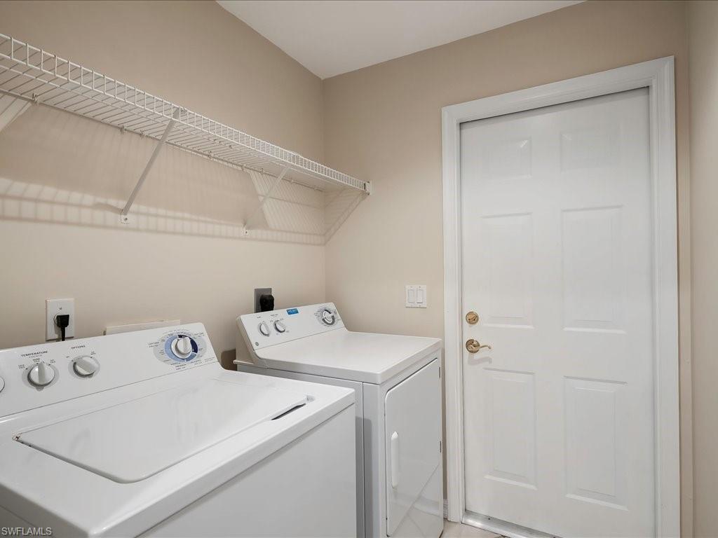 4655 Hawks Nest Way, Unit 103 Naples, FL 34114 - Photo 22 of 33 a utility room with dryer and washer