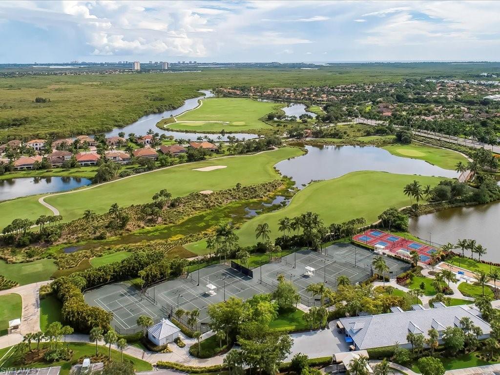 4655 Hawks Nest Way, Unit 103 Naples, FL 34114 - Photo 33 of 33 an aerial view of ocean and residential houses with outdoor space